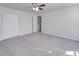 Clean and spacious bedroom with neutral walls, carpet, and closet space at 5670 Hammermill Dr, Harrisburg, NC 28075