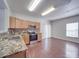 Well-equipped kitchen with stainless steel appliances, granite counters and tile backsplash at 5670 Hammermill Dr, Harrisburg, NC 28075