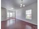 Spacious open-concept area with hardwood floors and neutral walls, great for entertaining at 5670 Hammermill Dr, Harrisburg, NC 28075