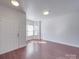 Bright living room featuring hardwood floors and a charming bay window at 5670 Hammermill Dr, Harrisburg, NC 28075