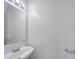 Simple powder room featuring a white vanity and faucet at 5670 Hammermill Dr, Harrisburg, NC 28075