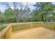 The wooden deck provides a great space for relaxing and enjoying the backyard views at 574 Pamela Rd, York, SC 29745