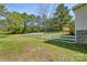 Spacious backyard featuring a white fence, mature trees, and an inviting wooden deck at 574 Pamela Rd, York, SC 29745
