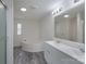 Bright bathroom with double vanity, tub, and modern lighting at 574 Pamela Rd, York, SC 29745