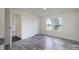 Bright bedroom with gray floors, a closet, an en-suite bathroom, and dual windows overlooking the property at 574 Pamela Rd, York, SC 29745