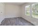 Bright bedroom features light gray flooring, white walls, and natural light at 574 Pamela Rd, York, SC 29745
