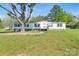 Charming single-story home with green shutters and mature trees on a spacious lawn at 574 Pamela Rd, York, SC 29745