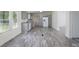 Spacious kitchen with gray cabinets, granite countertops, stainless appliances, and an adjoining laundry area at 574 Pamela Rd, York, SC 29745