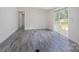 Inviting living room featuring stylish gray flooring and a sliding glass door that opens to an outdoor deck at 574 Pamela Rd, York, SC 29745
