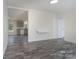 Open-concept living area with gray flooring flowing into a connected kitchen space at 574 Pamela Rd, York, SC 29745