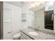Bathroom featuring granite vanity, large mirror, and walk-in shower at 5962 Charlie Walker Rd, Kannapolis, NC 28081