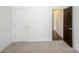 Carpeted bedroom with closet and neutral walls at 5962 Charlie Walker Rd, Kannapolis, NC 28081