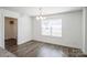Cozy dining room area with wood-look floors and window at 5962 Charlie Walker Rd, Kannapolis, NC 28081