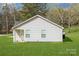 Charming home with white siding, manicured lawn, and natural surroundings at 5962 Charlie Walker Rd, Kannapolis, NC 28081
