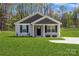 Charming single-story home with a well-manicured lawn and a classic exterior design at 5962 Charlie Walker Rd, Kannapolis, NC 28081