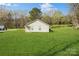 Charming single story home on a large lot featuring mature landscaping and a well-manicured lawn at 5962 Charlie Walker Rd, Kannapolis, NC 28081