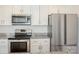 Contemporary kitchen design with stainless steel appliances and granite countertops at 5962 Charlie Walker Rd, Kannapolis, NC 28081