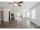 Open-concept living space with hardwood floors, ceiling fan, and plenty of natural light at 5962 Charlie Walker Rd, Kannapolis, NC 28081
