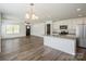 Open-concept living room and kitchen with granite countertops and stainless appliances at 5962 Charlie Walker Rd, Kannapolis, NC 28081