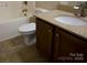 Bathroom with a toilet, tile floor, vanity with granite countertop, and a bathtub at 7283 Bradberry Ln, Denver, NC 28037