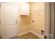 Bright laundry room featuring storage cabinets and convenient access, perfect for efficient home management at 7283 Bradberry Ln, Denver, NC 28037