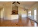 Open living space with hardwood floors, kitchen access, and vaulted ceilings at 7283 Bradberry Ln, Denver, NC 28037