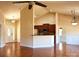 Open living space with hardwood floors, kitchen access, and vaulted ceilings at 7283 Bradberry Ln, Denver, NC 28037