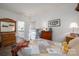 Bright bedroom featuring a quaint quilt, hardwood floors, and easy access to the ensuite bathroom at 7924 Creek Park Dr, Denver, NC 28037