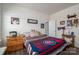 Inviting bedroom with ample natural light, wooden furniture, and playful decor accents at 7924 Creek Park Dr, Denver, NC 28037
