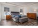 Bedroom featuring a bed, dresser, bench, hardwood floors, and plenty of natural light at 7924 Creek Park Dr, Denver, NC 28037