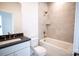 Bathroom featuring a sink and a shower/tub combo with tile surround at 8010 Elevate Ct, Charlotte, NC 28205
