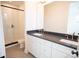Modern bathroom featuring a double vanity, quartz countertop, and a walk-in shower at 8010 Elevate Ct, Charlotte, NC 28205