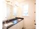 Elegant bathroom with double sinks, modern fixtures, and lots of light at 8010 Elevate Ct, Charlotte, NC 28205
