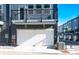 Attached garage with a clean white door and well-maintained exterior at 8010 Elevate Ct, Charlotte, NC 28205