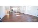 Open-concept living room leading to a modern kitchen with plenty of natural light at 8010 Elevate Ct, Charlotte, NC 28205
