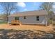 This cozy backyard features a wooden deck and a well-maintained lawn at 816 S Confederate Ave, Rock Hill, SC 29730