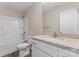 A well-lit bathroom showcases a granite vanity, ample storage, and a shower-tub combo at 816 S Confederate Ave, Rock Hill, SC 29730