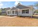 Stylish home boasts light gray siding, dark shutters, and meticulously maintained landscaping at 816 S Confederate Ave, Rock Hill, SC 29730