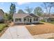 Charming home with a well-manicured lawn and a long driveway at 816 S Confederate Ave, Rock Hill, SC 29730
