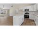 Modern kitchen featuring white cabinets, stainless steel appliances, and an island with a granite countertop at 816 S Confederate Ave, Rock Hill, SC 29730