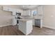 Modern kitchen with stainless steel appliances, center island, and bright, white cabinetry at 816 S Confederate Ave, Rock Hill, SC 29730