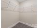A walk-in closet featuring wire shelving and carpeted floors providing ample storage space at 816 S Confederate Ave, Rock Hill, SC 29730