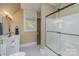 Bright bathroom featuring a tiled floor, a glass-enclosed shower and modern vanity at 820 N Main St, Salisbury, NC 28144