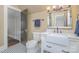 Bathroom featuring a white vanity, a farmhouse sink, and a tiled floor at 820 N Main St, Salisbury, NC 28144