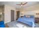 Cozy bedroom with a bed, a ceiling fan and two doorways at 820 N Main St, Salisbury, NC 28144