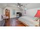 Bright bedroom with hardwood floors, a workstation and a ceiling fan at 820 N Main St, Salisbury, NC 28144