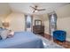 Cozy bedroom with hardwood floors, a blue bedspread, and a ceiling fan for year-round comfort at 820 N Main St, Salisbury, NC 28144