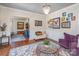 Bright living area featuring hardwood floors, a decorative rug, and artistic wall decor at 820 N Main St, Salisbury, NC 28144