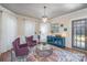 Elegant living room with hardwood floors, stylish furnishings, and an eye-catching chandelier at 820 N Main St, Salisbury, NC 28144