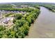 Scenic aerial view of the community near the river, surrounded by lush green trees at 822 Flatwater Ct, Fort Mill, SC 29708